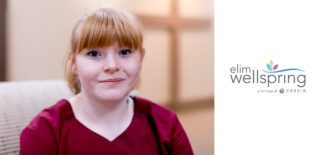 Jade, a CNA at Elim Wellspring, poses for a picture