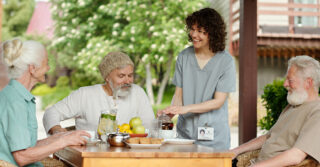 A group of seniors enjoying treats and lemonade