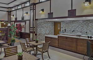Well-maintained interior space with seating, tables, and wood finishes, representing comfortable and updated living environments supported by Cassia